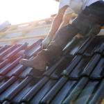 Roofing contractors working on a new roof
